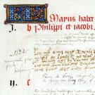 Vue d'un détail d'une page d'un manuscrit avec une lettrine et des écritures gothiques, cursifs