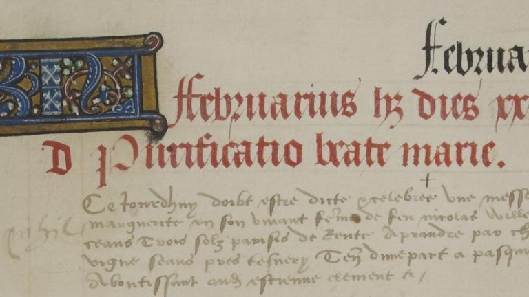 texte de manuscrits avec une lettrine, une première ligne écrite en couleur rouge et la suite de couleur marron